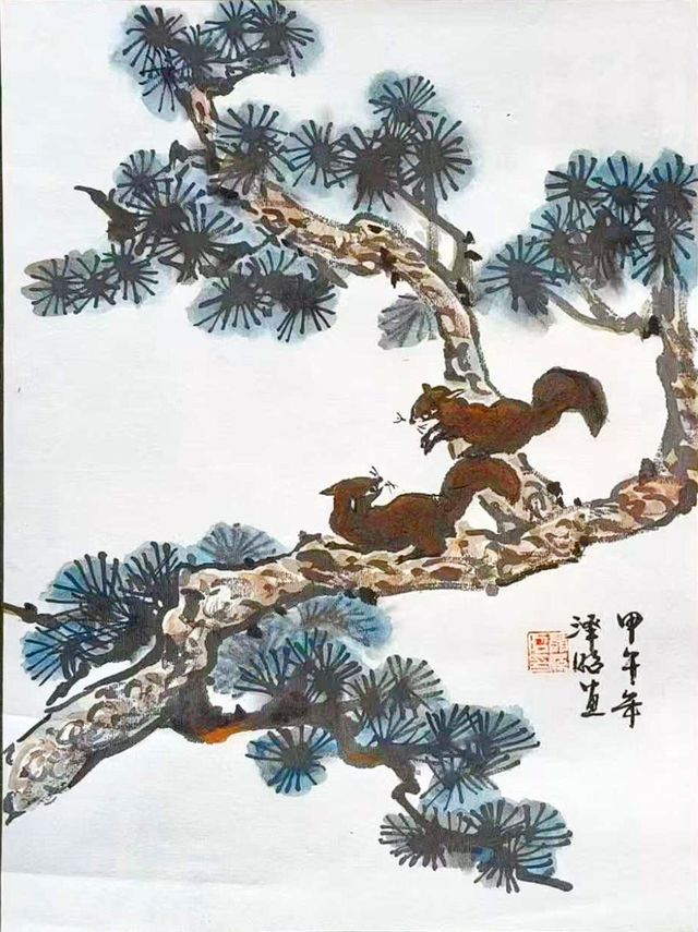 Two squirrels on a pine branch