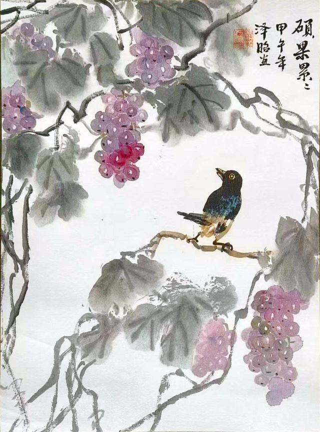 Purple grapes with a bird perched on a branch