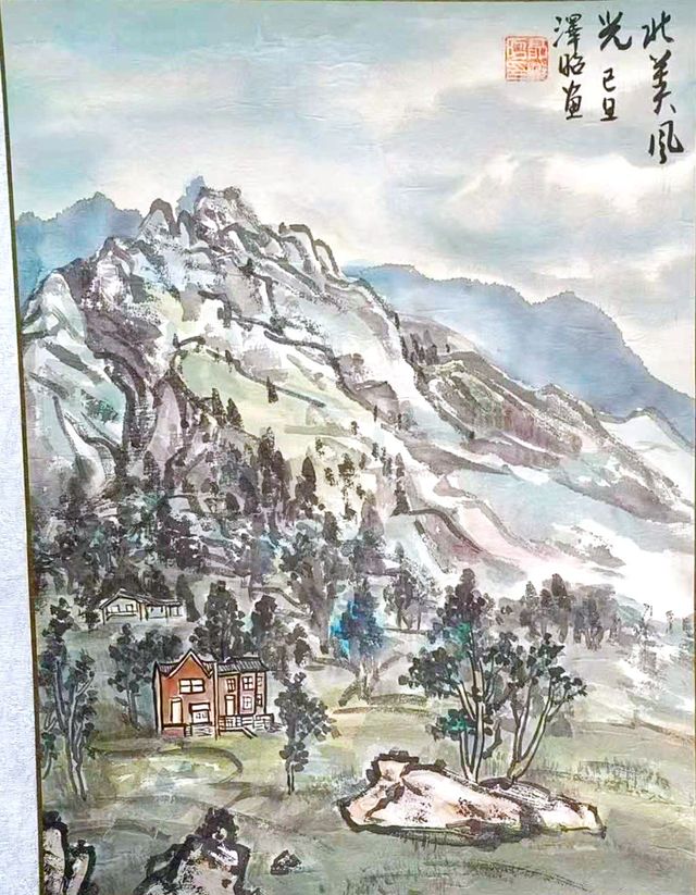 Green mountain valley with a small house