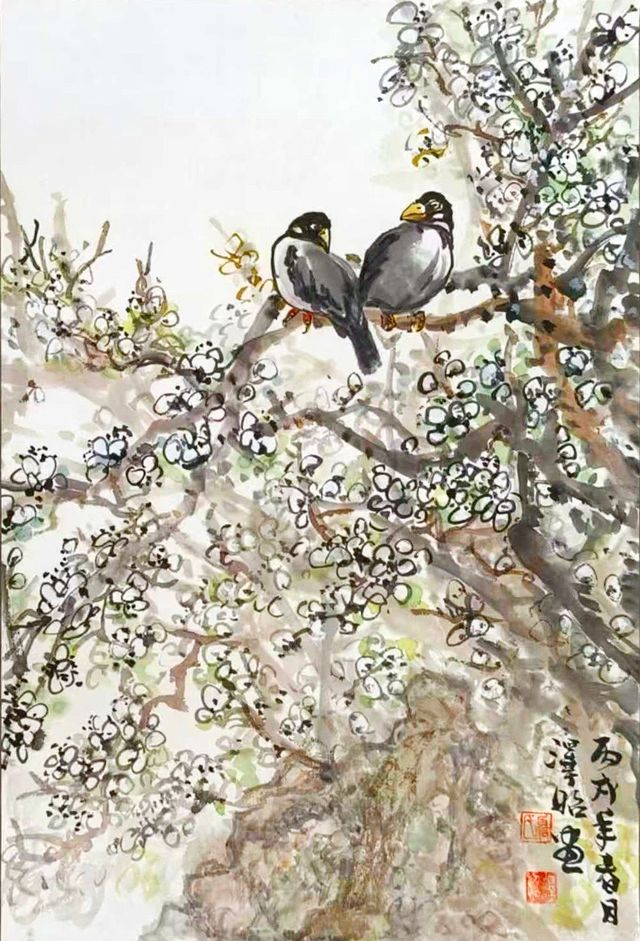 Two birds on a blossoming branch
