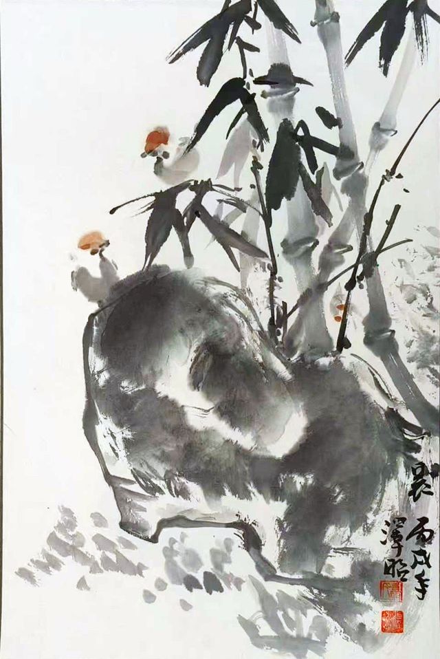 Bird on a large rock with bamboo