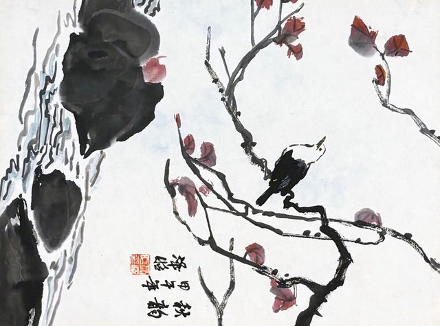 Bird on a branch with autumn leaves
